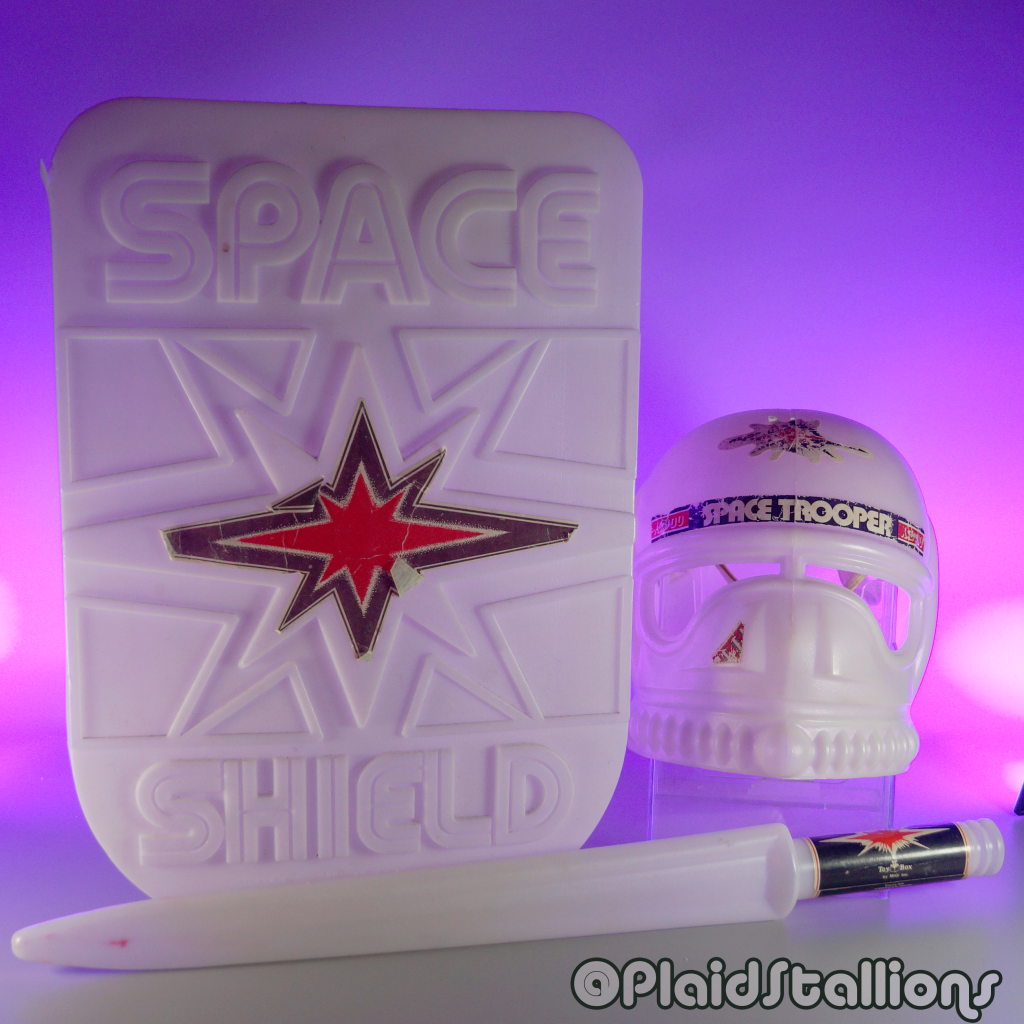 I realized I havne't documented completing the glow-in-the-dark trinity of Space Sword, Space Shield, and Space Trooper Helmet by Toy Box Inc.

Meant to cash in on Star Wars, these wonderful toys were somehow better than what Kenner offered in terms of light sabers. 

I  had the shield and sword as a kid (via @canadiantire), and they were the best, but I never got that helmet. My pal @peterjoek gifted me one this fall, and well, it's about time I showed them off!

#starwars #toyventures #starwarsknockoff #spacesword #spaceshield #glowinthedark #bootlegstarwars #plaidstallions 